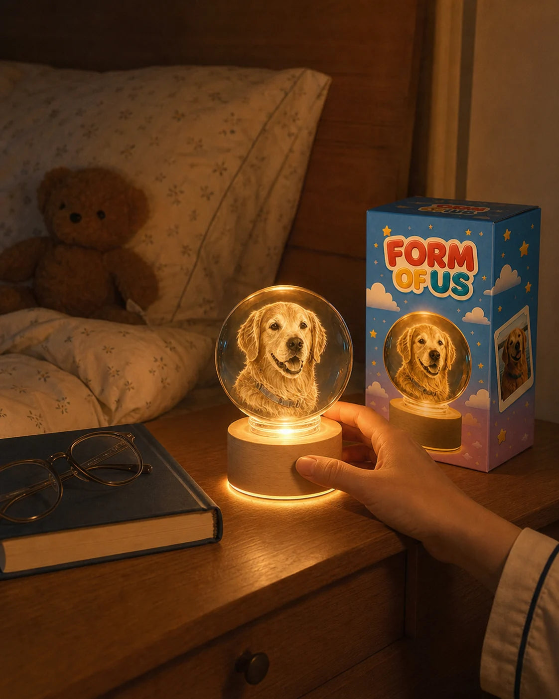 An illuminated pet crystal globe on a bedside table